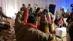Awais shares a dance with his father. 