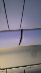 Water dripping from the overhead bins.