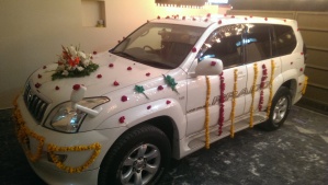 The car that will be taking the groom to his wedding.